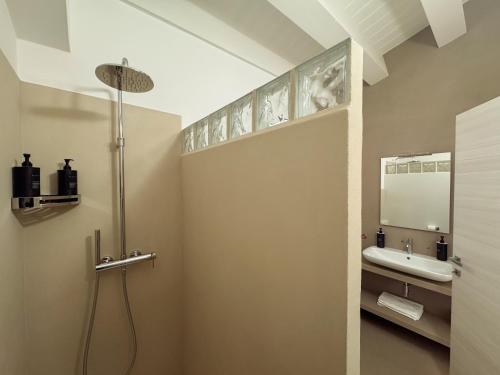 a bathroom with a sink and a mirror at ORTO NOTO - Agri Resort in Noto