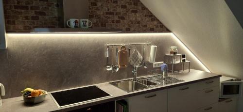 a kitchen with a sink and a counter top at Daislehof in Münstertal