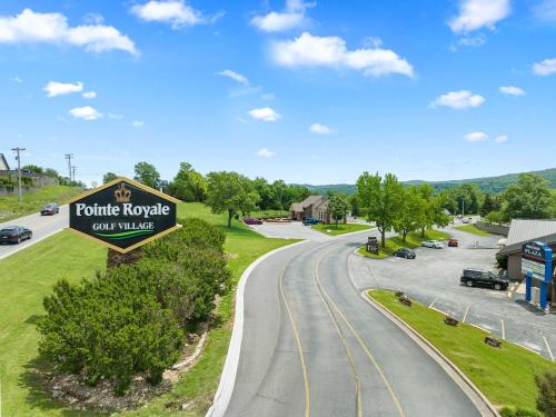 a sign for a police nozzle car village on a road at Hole-in-One Hideaway For 4 in Branson