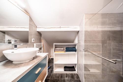 a bathroom with a sink and a shower at Chalet Tante Emma proche Lac Leman in Vacheresse