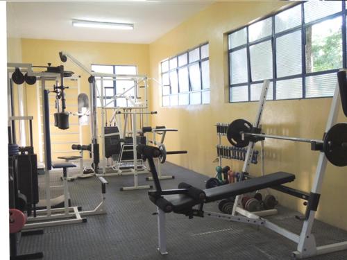 a gym with several treadmills and exercise equipment at Pousada Juriti - Eco Hotel in São Roque
