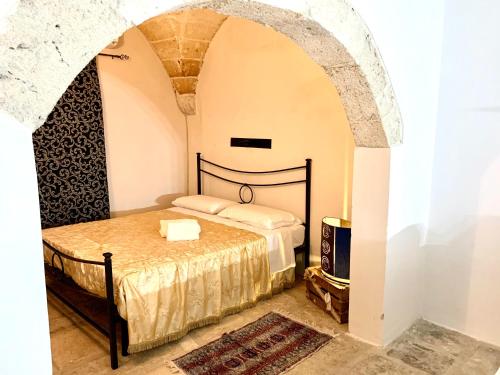 a bedroom with a bed in a room at Antica e luminosa masseria in Lequile