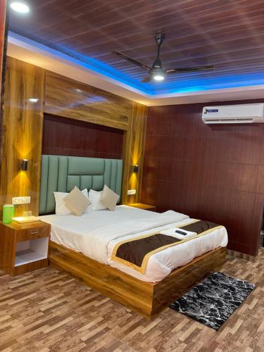 a bedroom with a large bed in a room at Jungle Beach Resort in Neil Island