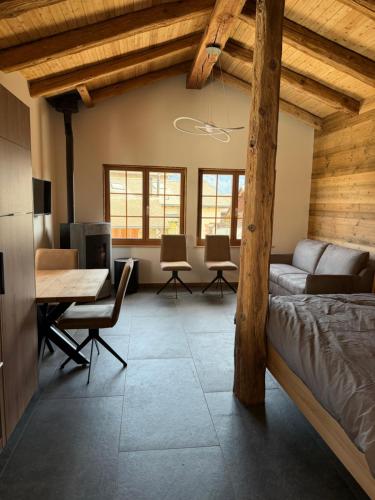 a living room with a couch and a table at Le mazot in Lens