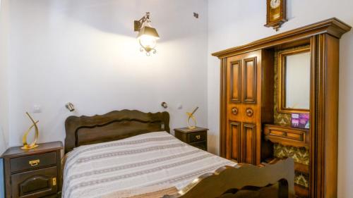 a bedroom with a bed and a dresser and a mirror at Villa Zebo by Villas Guide in Barban