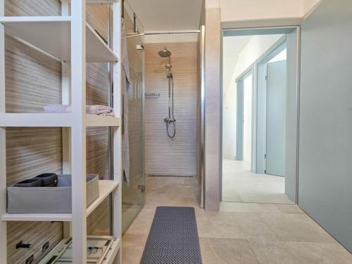 a bathroom with a shower and a walk in closet at Sea House 1 in Novigrad Istria