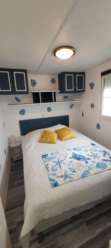 a bedroom with a large bed in a room at Mh 229 La Tremblade in La Tremblade