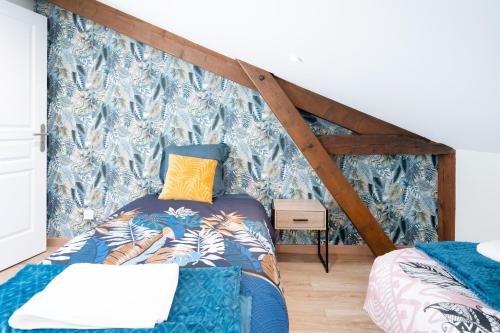 a bedroom with a bed with a canopy at Gite de Laluby in Arx