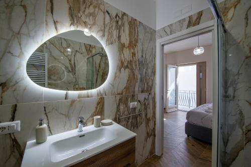 a bathroom with a sink and a mirror at L'Incanto dei Monti in Agerola