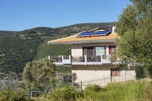 a house with a solar panel on the roof at Treanto Nafpaktos Boutique Hotel in Nafpaktos