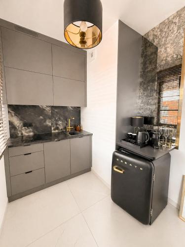 Foto DOKI Living Suites - Foodhall & Parking by Downtown Apartments 5