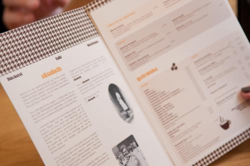 a person reading a book with a computer mouse at Cafe Elisabeth in Mutterstadt