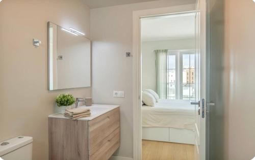 a bathroom with a sink and a mirror at El Rincón del Charco in Arrecife