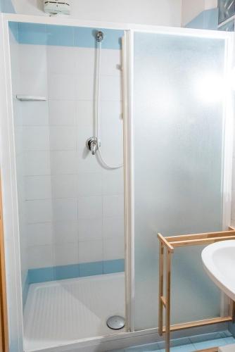 a shower with a glass door in a bathroom at Casa Cortese Sirolo in Sirolo