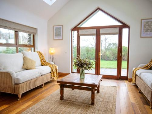 a living room with a couch and a coffee table at Just Beyond Dingle in Dingle