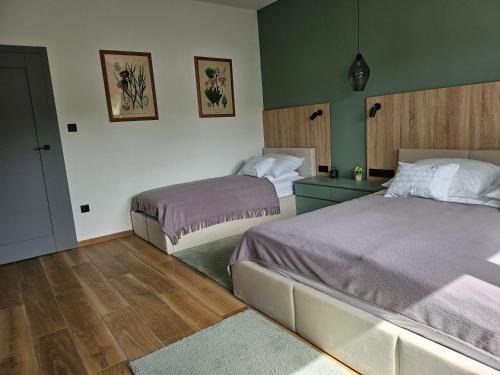a room with two beds in a room at Studio apartmen in Budapest