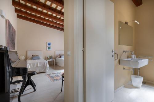 a bathroom with a sink and a mirror at Villa Casale by PosarelliVillas in Bisciano