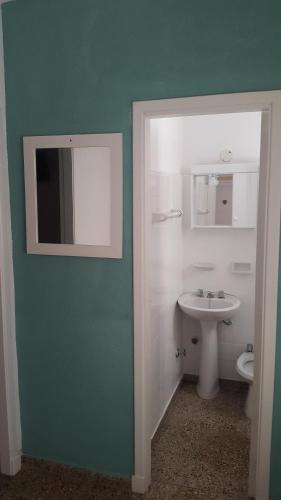 a bathroom with a sink and a toilet at Continente Park in San Clemente del Tuyú