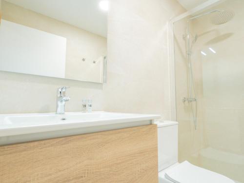 a bathroom with a sink and a toilet at YBH Villa Lara in Villanueva de Arosa