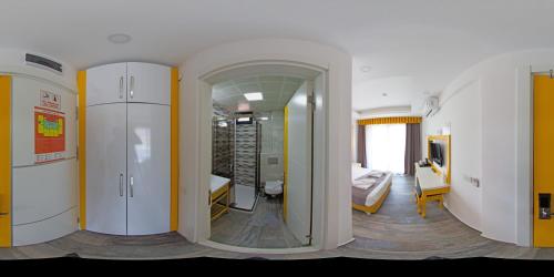a room with a bedroom and a living room at Yade Luxe Hotel in Marmaris