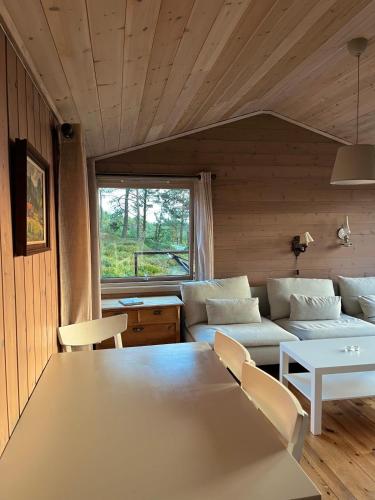 a living room with a couch and a table at Panoramic View - near Pulpit Rock in Strand
