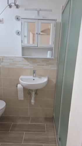 a bathroom with a sink and a shower at Al Capitello in Lacco Ameno