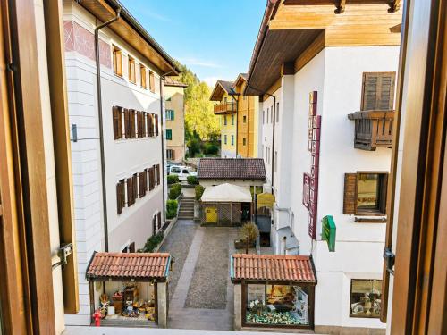 a view from a window of a street with buildings at ElvesHome - Alpine Stay Apartments in Predazzo