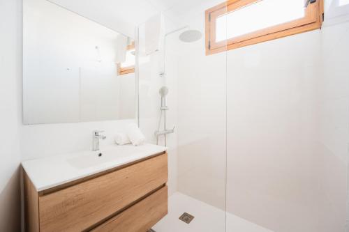 a bathroom with a sink and a mirror at CARABELA 92 in Alcudia