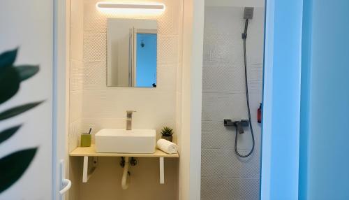a bathroom with a sink and a mirror at Casa de Oaspeti 2 Mai in 2 Mai