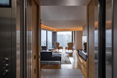 a living room with a couch and a table at Kozue in Kutchan