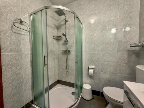 a bathroom with a shower and a toilet and a sink at Jellyfish in Malinska