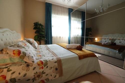 a bedroom with a bed and a large mirror at Raggio di sole in Catania