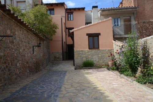 an alley in a village with buildings at Casa Domingo in Manzanera