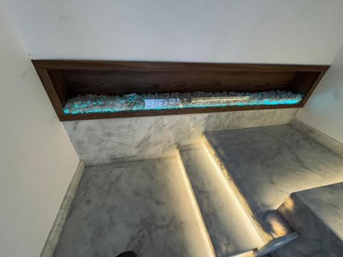 a room with a shelf with rocks on the floor at Hôtel kairouan in Fez