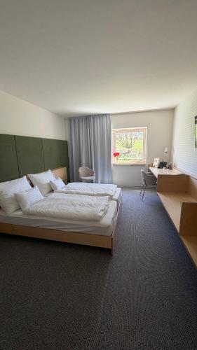 Postel nebo postele na pokoji v ubytování Hotel Farma