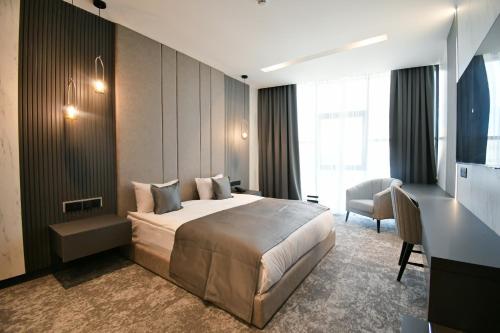 a hotel room with a bed and a desk at Dorana Hotel Gazimagusa in Famagusta