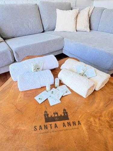 a living room with a couch and a wooden floor at Luxury Loft en Maspalomas con Terraza y Piscina in Maspalomas