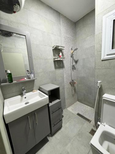 a bathroom with a sink and a shower at Poolfront Sea View Chalet Top Rated In Dahab in Dahab