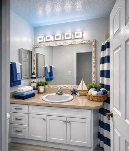 a bathroom with a sink and a mirror at Amazing views & steps to beach 2B-2Bath-Pool - 207 in Clearwater Beach