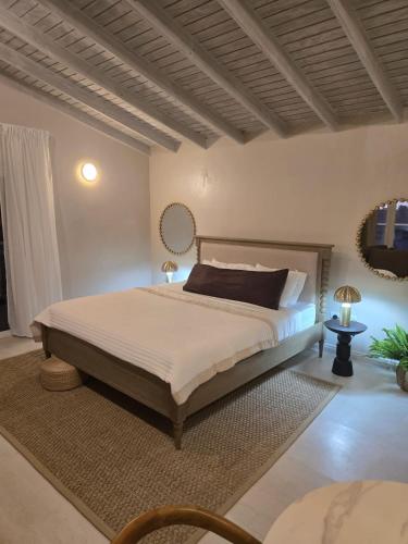 a bedroom with a large bed in a room at Mullins Townhouse in Saint Peter