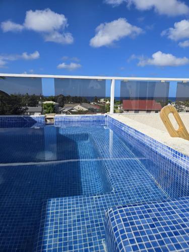 a swimming pool on the roof of a building at Mullins Townhouse in Saint Peter