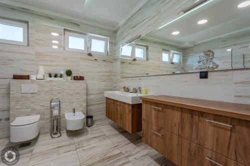 a bathroom with a toilet and a sink at Vila Eleonora Beograd in Belgrade