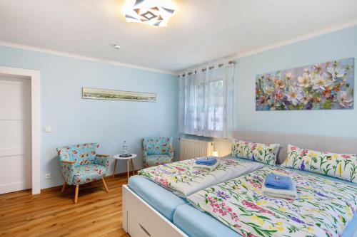 a bedroom with a bed and a table and chairs at Ferienhaus Weitblick in Dresden