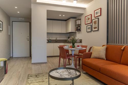a living room with a couch and a table at Easter Suites Luxury - Signature Stays in Monopoli in Monopoli