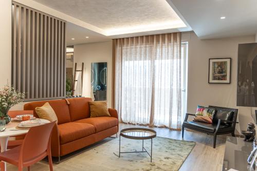 a living room with a couch and a table at Easter Suites Luxury - Signature Stays in Monopoli in Monopoli