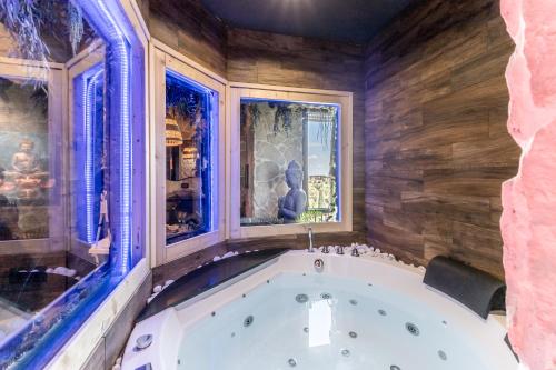 a bath tub in a room with a window at Int 37 Luxury Rooms in Rome