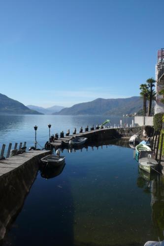 a large body of water with boats in it at Art Hotel Ristorante Posta Al Lago in Ronco s/Ascona - Porto Ronco