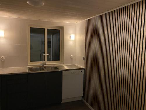 a bathroom with a sink and a mirror at Idyllic house in Timmernabben in Timmernabben