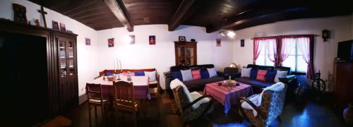 a living room with a couch and a table at Chalupka pod Kozincom - Zázrivá in Zázrivá