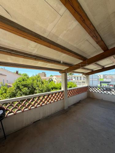 an empty balcony with a view of a city at Bosquet in Valence